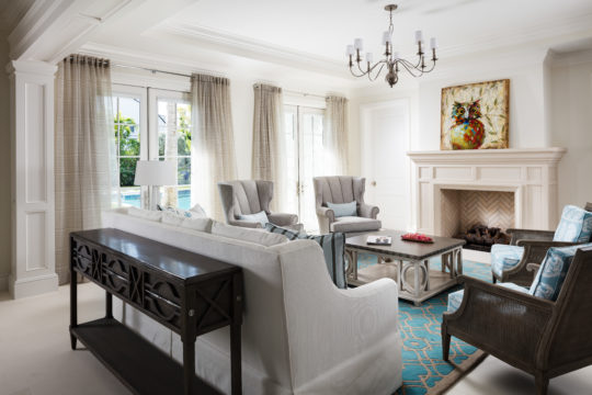 Living room with fireplace inside the Palmo home by Ecclestone.