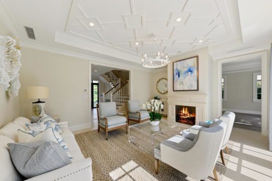 living room with fireplace remodeled by llwyd ecclestone