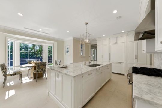Bright with kitchen with large island by llywd ecclestone homes
