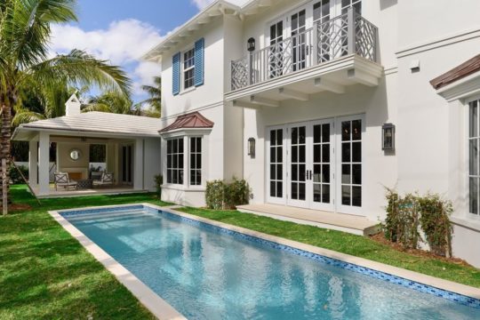 lap pool along the side of bahama home by ecclestone