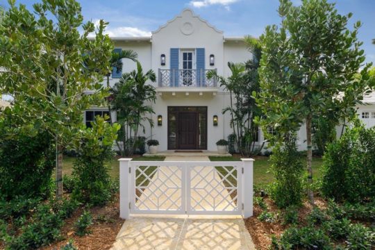exterior elevation of white painted home with blue shutters by llwyd ecclestone