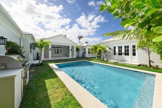 large pool in the middle of the backyard at sandpiper