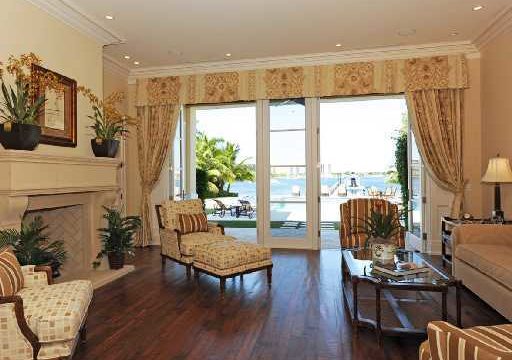 Old Harbour Living room with fireplace and view of water