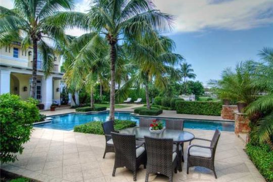 Lost Tree Village Patio and Landscape with pool and table