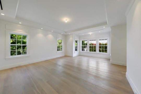 bahamas large living area with wood floors by ecclestone homes