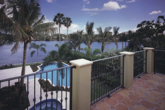 Villa Providencia Balcony overlooking the pool and the water in Palm Beach