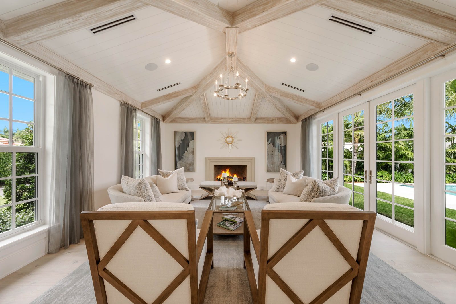 interior of sitting room with fireplace and high ceilings - remodeled by Ecclestone Homes
